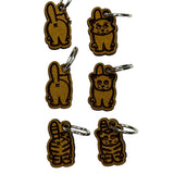 Wooden stitch markers with engraved detail of a cat facing front and back
