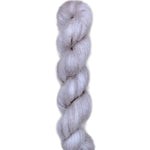 Skein of superkid mohair silk lace weight yarn color grey white