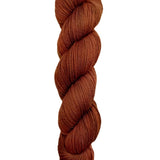 A skein of hand-dyed fingering/sock yarn color auburn burnt orange