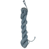 A skein of grey yarn on a white background