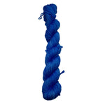 Blue skein of yarn on a white background