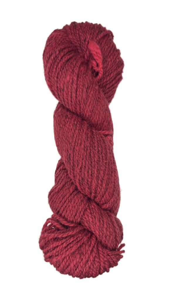 Red skein of wool yarn on a white background