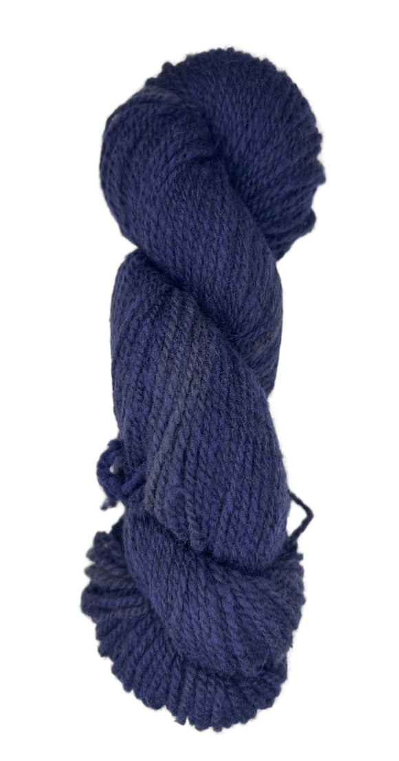 Blue skein of wool yarn on a white background