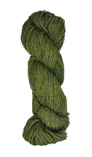 Green skein of wool yarn on a white background