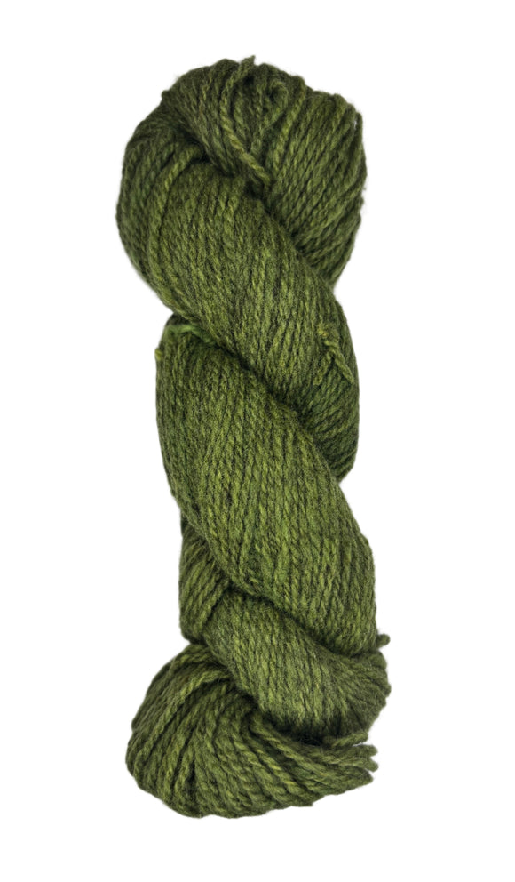 Green skein of wool yarn on a white background