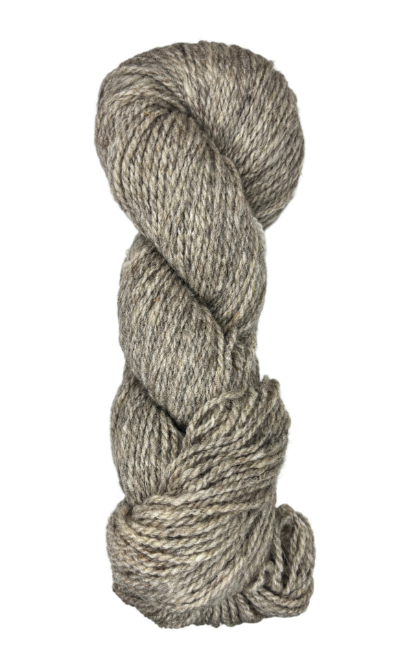 Coiled skein of gray wool yarn on a white background