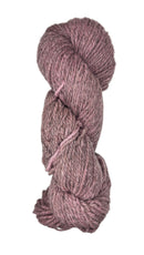 Coiled skein of pink yarn on a white background