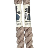 Two mini skeins of wool yarn hand dyed in Wyoming in the color off-white