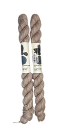 Two mini skeins of wool yarn hand dyed in Wyoming in the color off-white