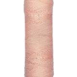 A photo of a skein of apricot Coastal Cotton Cotton Yarn