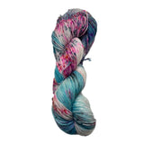 Multicolored skein of yarn on a white background