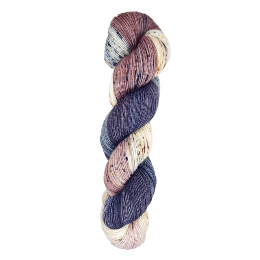 A skein of hand-dyed fingering/sock yarn color mauve white grey black speckles