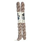 Two mini skeins of wool yarn hand dyed in Wyoming in the color off-white