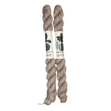 Two mini skeins of wool yarn hand dyed in Wyoming in the color off-white