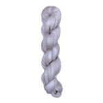 Skein of superkid mohair silk lace weight yarn color grey white