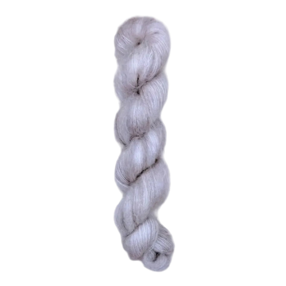 Skein of superkid mohair silk lace weight yarn color grey white