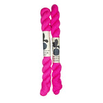 Two mini skeins of wool yarn hand dyed in Wyoming in the color pink