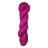 Skein of hand dyed BFL Tweed yarn in a neon pink color