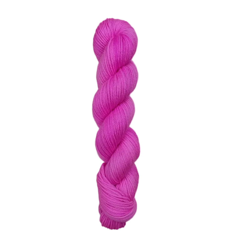 Pink skein of yarn on a white background