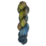 Skein of hand dyed yarn in the colors yellow black blue white brown 