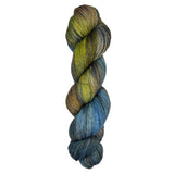 Skein of hand dyed yarn in the colors yellow black blue white brown 