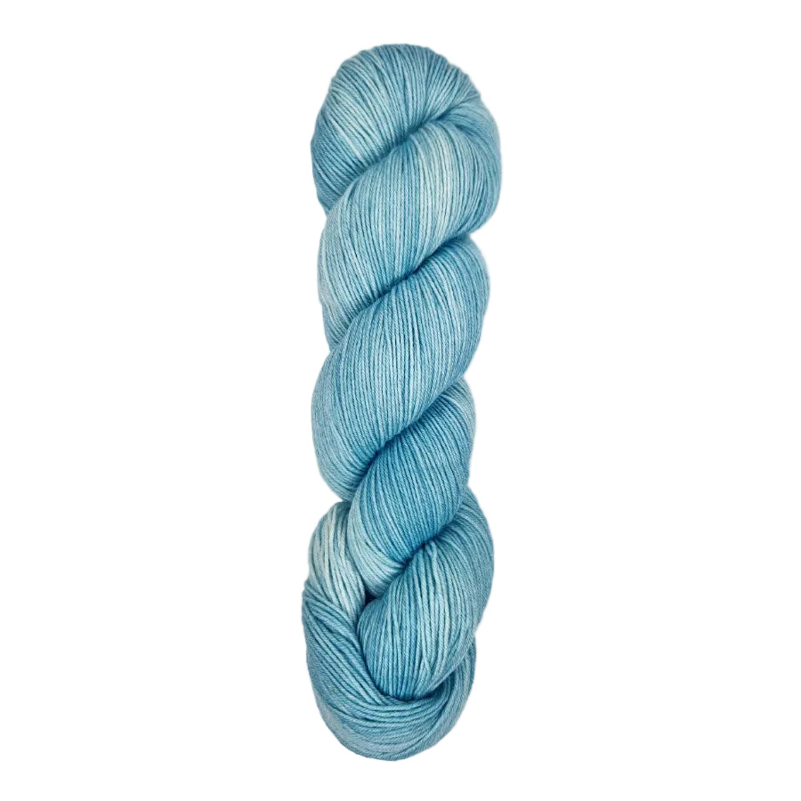 A skein of hand-dyed fingering/sock yarn color light grey white blue 
