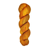A skein of hand-dyed fingering/sock yarn color orange and brown