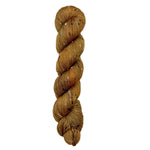 Skein of hand dyed BFL Tweed Yarn color golden brown