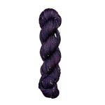 Skein of hand dyed BFL Tweed Yarn color deep purple