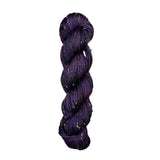 Skein of hand dyed BFL Tweed Yarn color deep purple