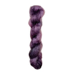 Skein of superkid mohair silk lace weight yarn color purple black