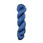 Blue skein of yarn on a white background