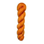 A single skein of bright orange yarn 