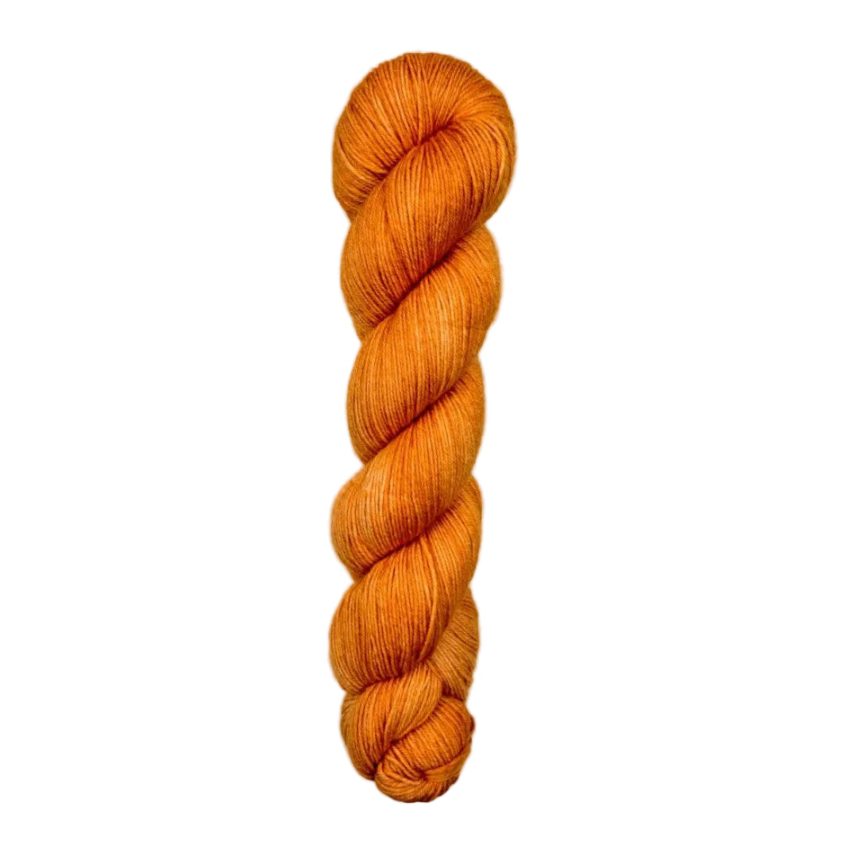 A single skein of bright orange yarn 