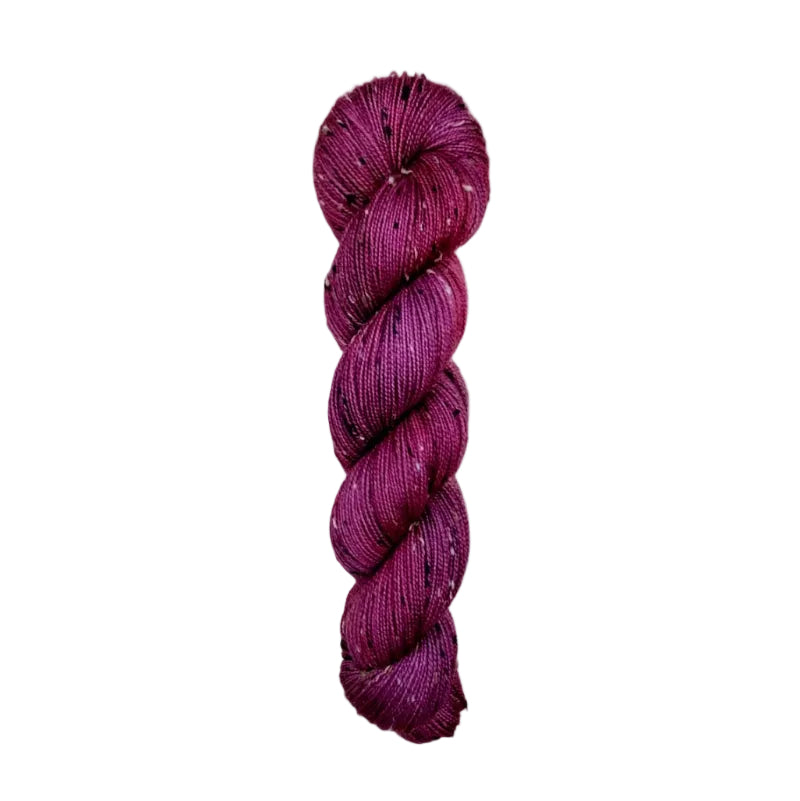 Skein of hand dyed BFL Tweed Yarn color wine red