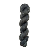 Skein of hand dyed BFL Tweed Yarn color steel grey 