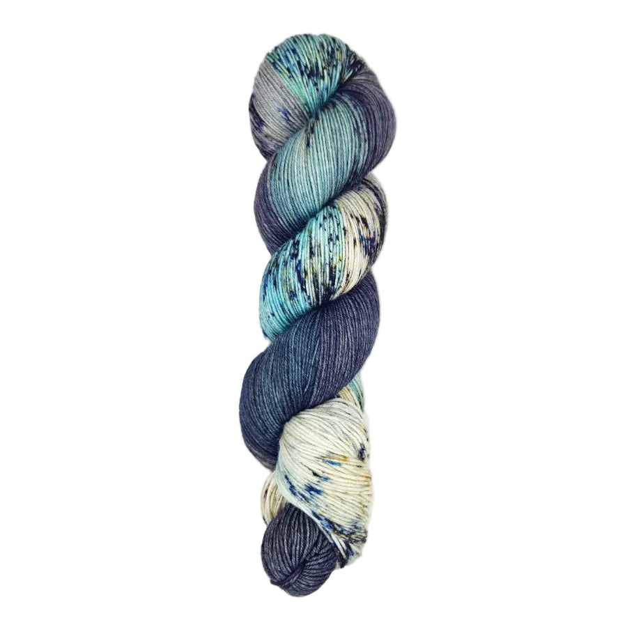 A skein of hand-dyed fingering/sock yarn color sky blue black white grey speckles