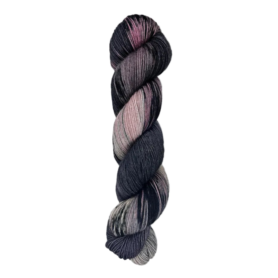 A skein of hand-dyed fingering/sock yarn color black mauve grey pink mild speckles