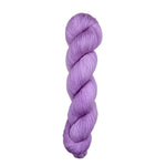 Purple skein of yarn on a light wooden surface