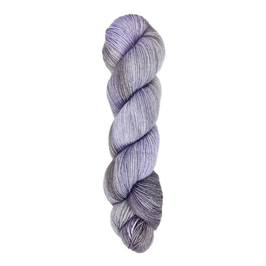 A skein of hand-dyed fingering/sock yarn color gray sky blue