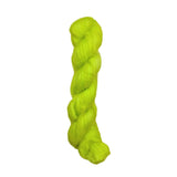 A bright neon yellow-green skein of twisted fuzzy yarn 