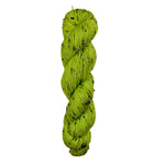 Green skein of yarn on a wooden surface