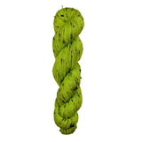 Green skein of yarn on a wooden surface