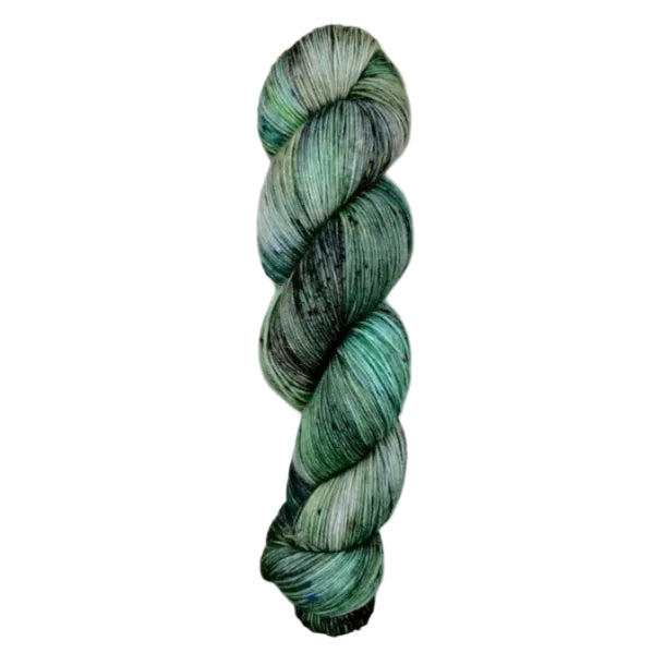 A skein of hand-dyed fingering/sock yarn color grey green black speckles