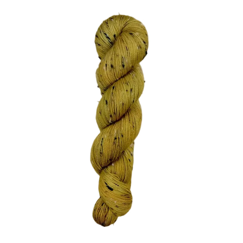 Skein of hand dyed BFL Tweed Yarn color golden yellow