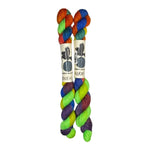 Two mini skeins of wool yarn hand dyed in Wyoming in the color green yellow blue orange purple