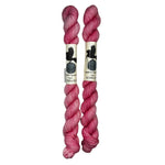 Mini Skeins of Hand Dyed yarn in the color bubblegum pink