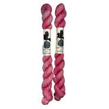 Mini Skeins of Hand Dyed yarn in the color bubblegum pink