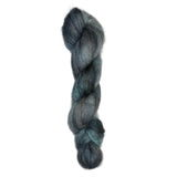 Skein of mohair silk yarn hand-dyed in Wyoming in the color grey blue black