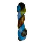 Skein of mohair silk yarn hand-dyed in Wyoming in the color blue green brown orange